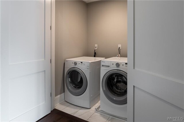 35 Ojibwa Cir, Buffalo, NY 14202 - laundry area featuring separate washer and dryer and baseboards