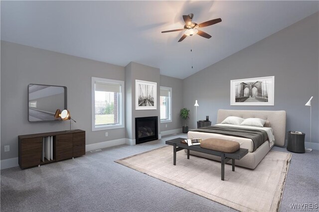 35 Ojibwa Cir, Buffalo, NY 14202 - bedroom with baseboards, vaulted ceiling, carpet flooring, and a glass covered fireplace