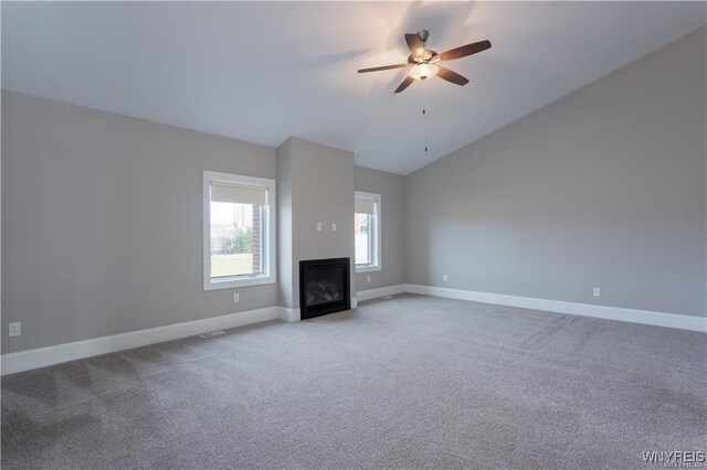 35 Ojibwa Cir, Buffalo, NY 14202 - unfurnished living room with carpet flooring, baseboards, a ceiling fan, and a glass covered fireplace