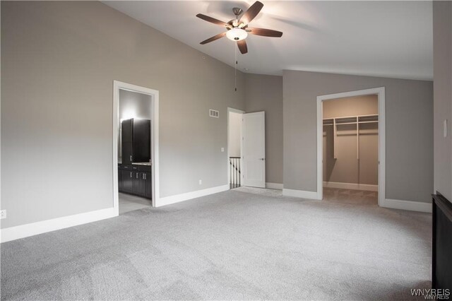 35 Ojibwa Cir, Buffalo, NY 14202 - unfurnished bedroom with baseboards, lofted ceiling, and light colored carpet