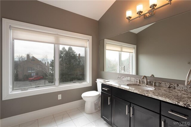 35 Ojibwa Cir, Buffalo, NY 14202 - half bath with tile patterned floors, toilet, baseboards, lofted ceiling, and vanity