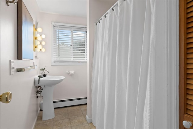 full bath featuring a baseboard heating unit, curtained shower, baseboards, and tile patterned flooring