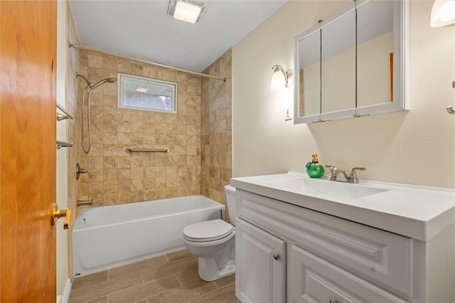 full bathroom featuring toilet, vanity, wood tiled floor, and bathing tub / shower combination