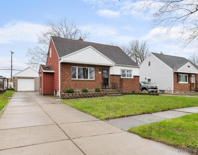 bungalow-style home with an outbuilding, a front lawn, driveway, brick siding, and a garage