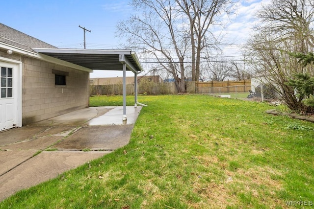 view of yard featuring fence and a patio