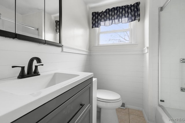 full bathroom with bathtub / shower combination, tile patterned floors, vanity, and toilet
