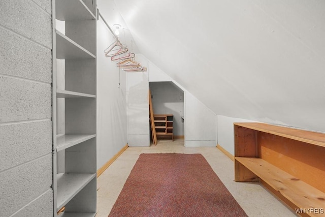 additional living space featuring lofted ceiling