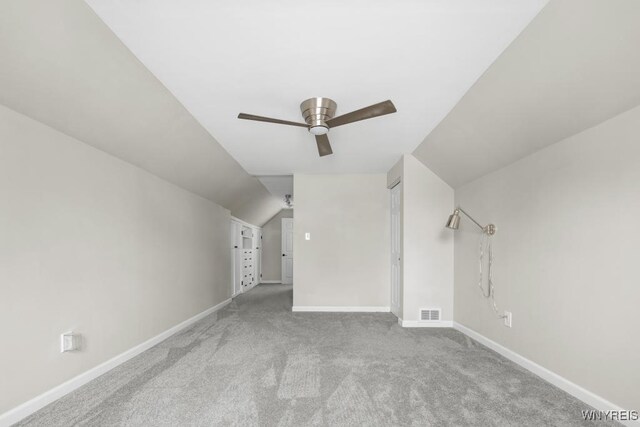additional living space with visible vents, carpet flooring, baseboards, and a ceiling fan