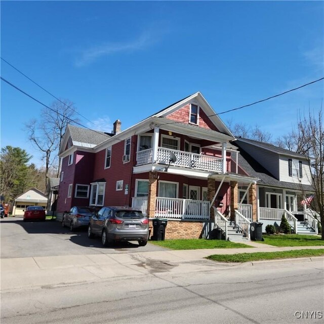 417 Otsego St, German Flatts, NY 13357 - view of front of property featuring a porch and a chimney