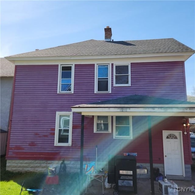 417 Otsego St, German Flatts, NY 13357 - back of property featuring a chimney and roof with shingles