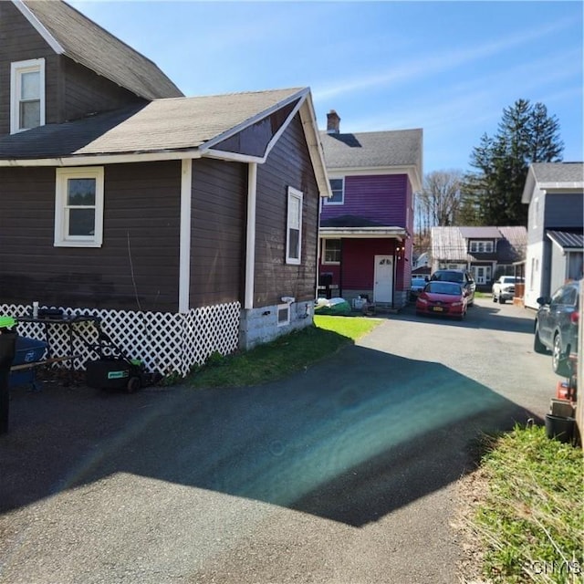 417 Otsego St, German Flatts, NY 13357 - view of home's exterior featuring driveway and a chimney