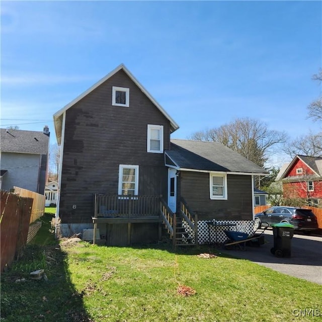417 Otsego St, German Flatts, NY 13357 - back of house featuring a lawn and fence