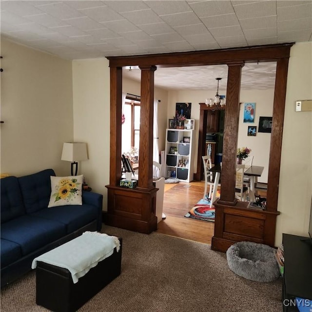 417 Otsego St, German Flatts, NY 13357 - carpeted living room featuring a chandelier and ornate columns