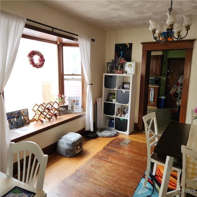417 Otsego St, German Flatts, NY 13357 - interior space featuring wood finished floors, visible vents, and a notable chandelier