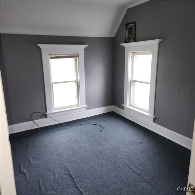 417 Otsego St, German Flatts, NY 13357 - carpeted spare room with lofted ceiling and baseboards