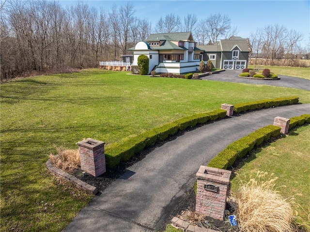 4872 Bedford Dr, Canandaigua-Town, NY 14424 - exterior space featuring a chimney, a front lawn, and driveway
