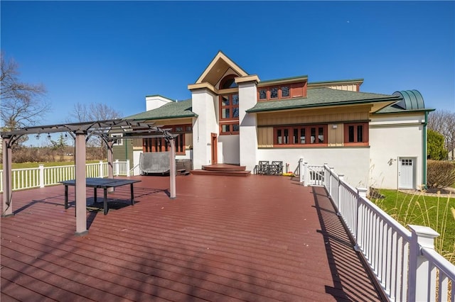 4872 Bedford Dr, Canandaigua-Town, NY 14424 - exterior space with stucco siding, a wooden deck, a pergola, and a shingled roof