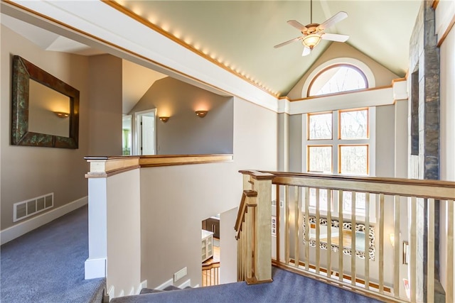 4872 Bedford Dr, Canandaigua-Town, NY 14424 - hallway featuring lofted ceiling, visible vents, an upstairs landing, baseboards, and carpet flooring