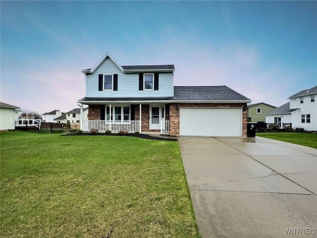 traditional home featuring covered porch, a front lawn, brick siding, and a garage