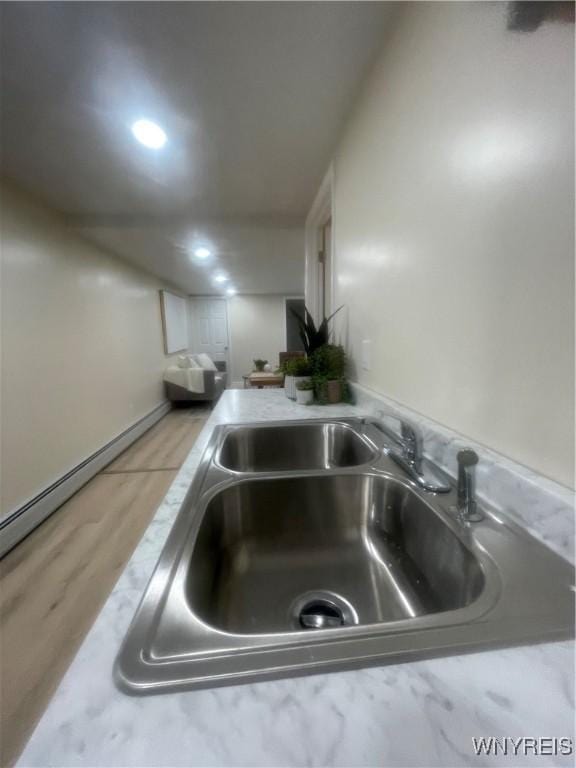 room details featuring a sink and recessed lighting
