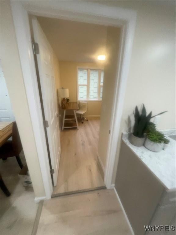 corridor with light wood finished floors