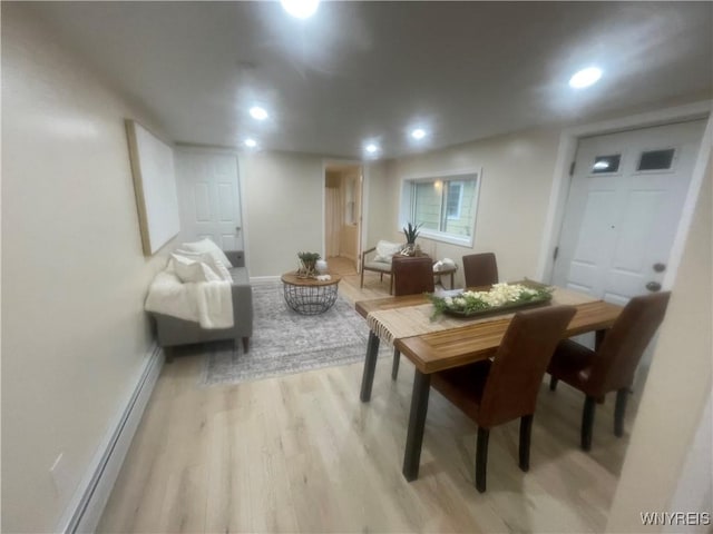 dining area with baseboards, recessed lighting, and light wood-type flooring