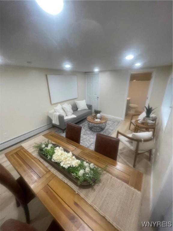 living area with recessed lighting and baseboards