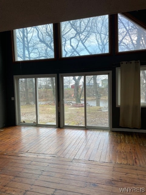 13289 Lakeview Dr, Carlton, NY 14571 - unfurnished living room with a wealth of natural light and a towering ceiling