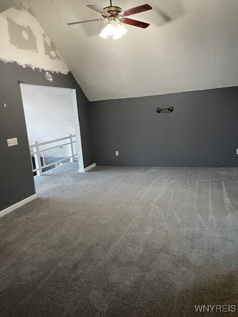 13289 Lakeview Dr, Carlton, NY 14571 - additional living space featuring baseboards, a ceiling fan, carpet flooring, and vaulted ceiling