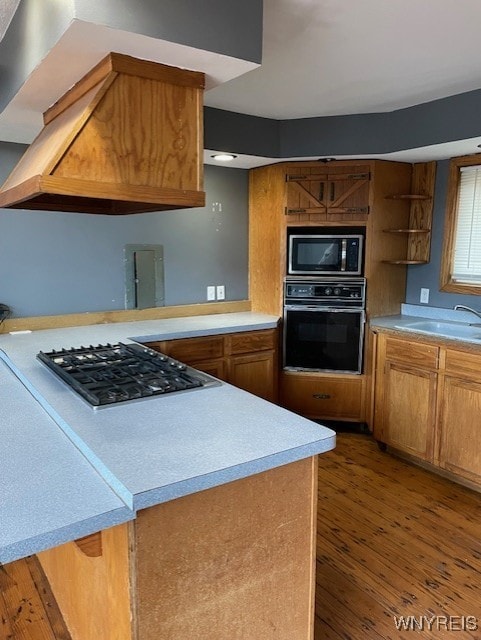 13289 Lakeview Dr, Carlton, NY 14571 - kitchen with brown cabinets, light countertops, wood finished floors, a sink, and appliances with stainless steel finishes