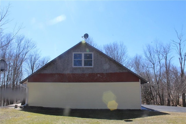 view of property exterior featuring a yard