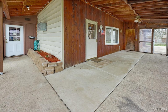 doorway to property with a ceiling fan