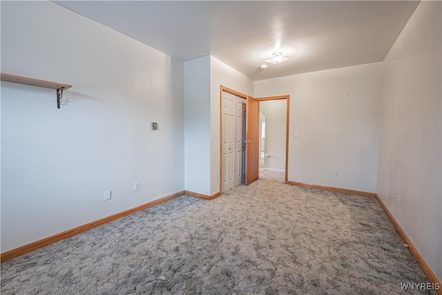 unfurnished bedroom with baseboards and carpet floors