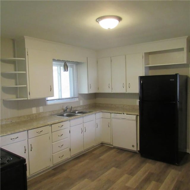 kitchen with black appliances, open shelves, white cabinets, and a sink
