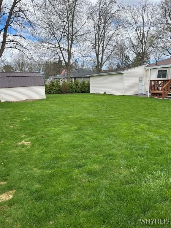 view of yard with a wooden deck