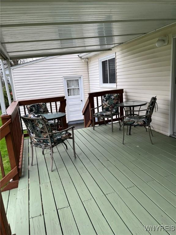 deck with outdoor dining space