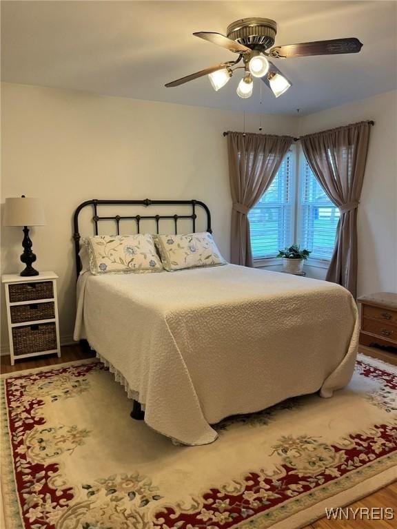 bedroom featuring ceiling fan and wood finished floors