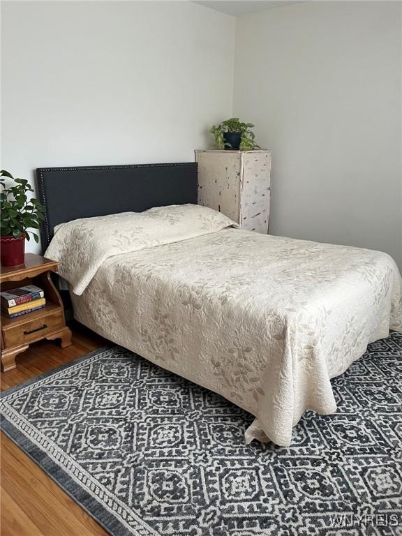 bedroom featuring wood finished floors