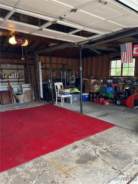 garage featuring a garage door opener