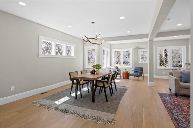 dining room with visible vents, baseboards, light wood-style floors, a chandelier, and recessed lighting