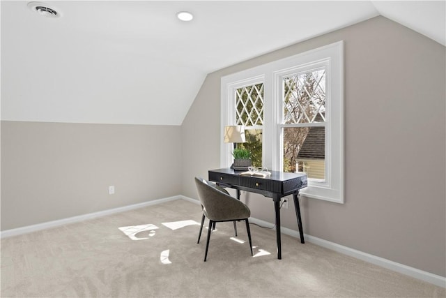 carpeted home office featuring lofted ceiling, visible vents, and baseboards