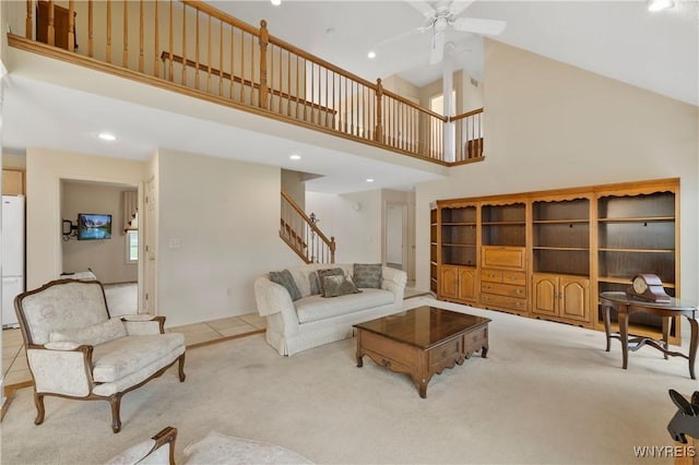 living area featuring recessed lighting, stairway, carpet flooring, high vaulted ceiling, and ceiling fan
