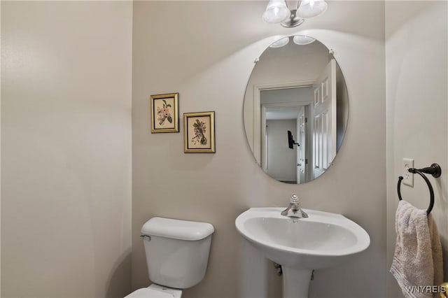 bathroom featuring toilet and a sink