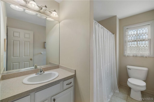 bathroom with a shower with curtain, tile patterned flooring, vanity, and toilet