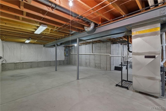 unfinished basement featuring electric panel