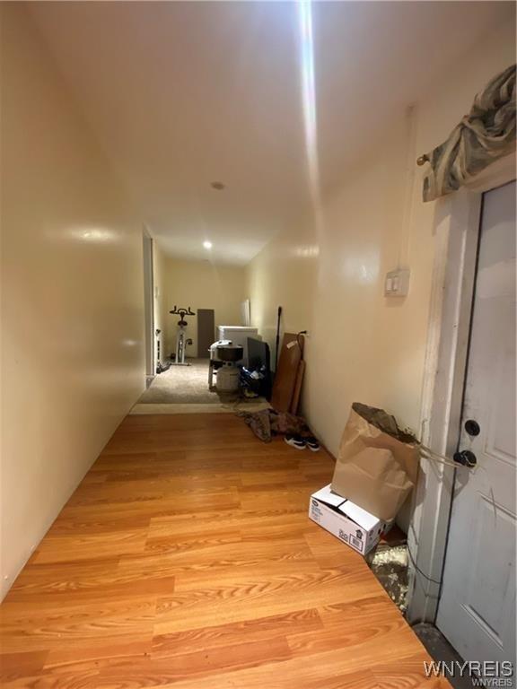 corridor with light wood finished floors