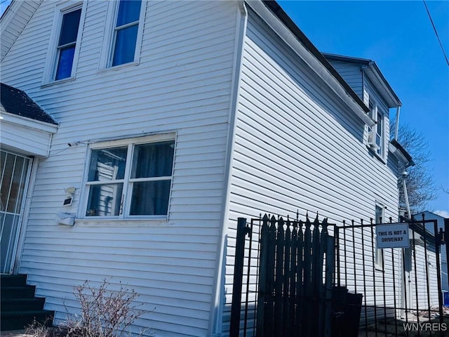view of property exterior with fence