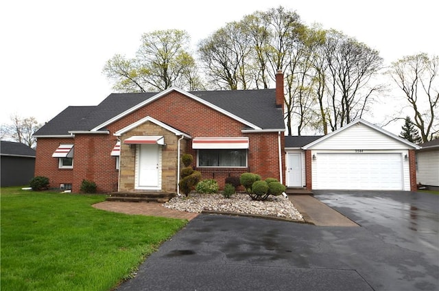 view of front of house with brick siding, an attached garage, driveway, and a front yard