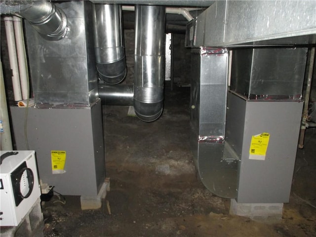 utility room featuring heating unit