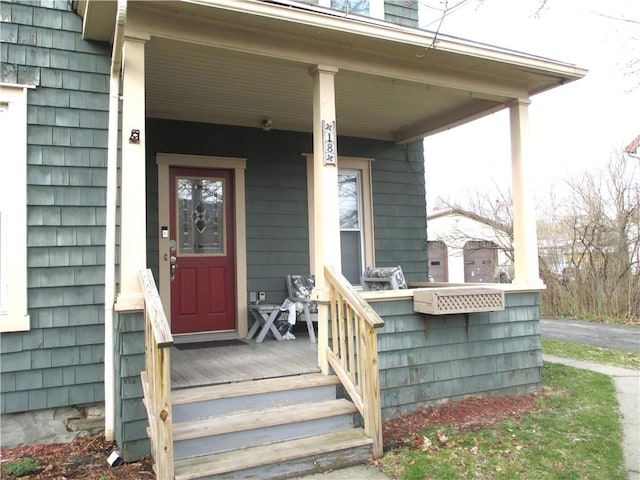 doorway to property featuring a porch